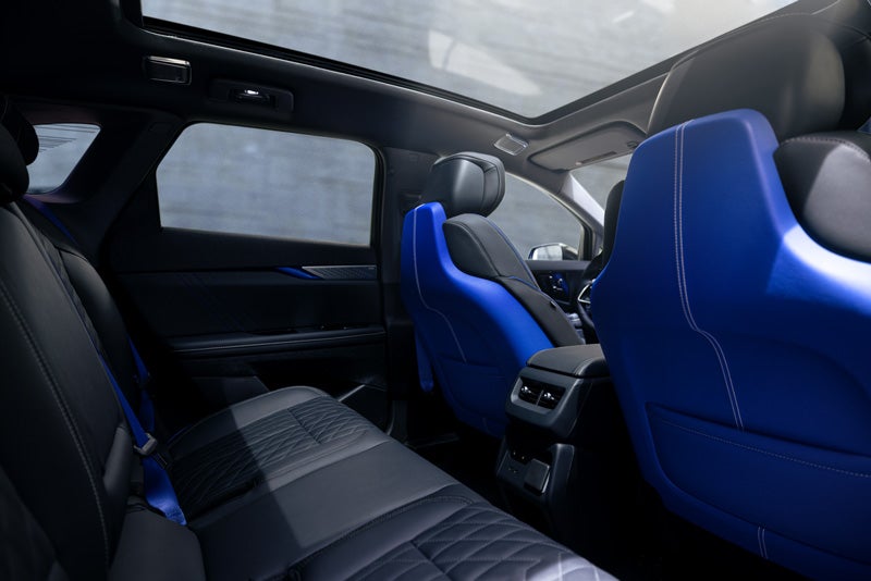 Back Seat View of the 2026 OPTIQ-V Blue Front Seats, Sun Roof, and Interior | Wilson Cadillac of Stillwater in Stillwater OK